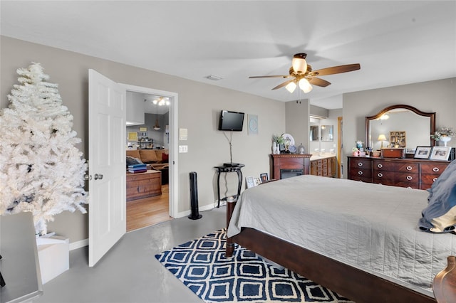 bedroom with ceiling fan and ensuite bathroom