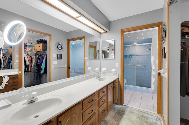 bathroom with vanity and an enclosed shower