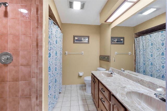 bathroom with vanity, tile patterned floors, toilet, and a shower with shower curtain