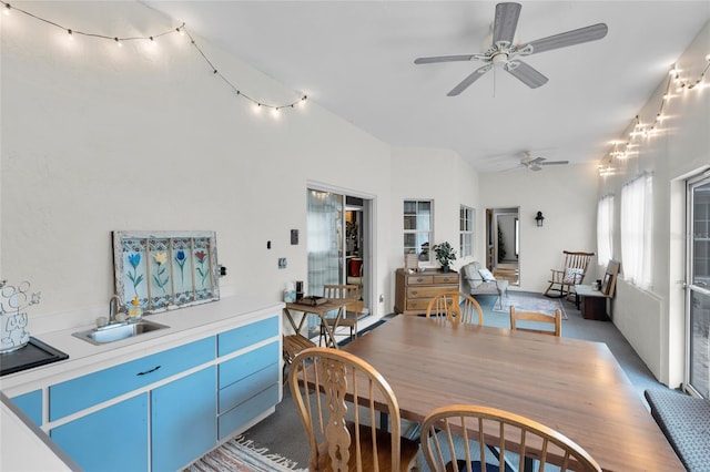 carpeted dining space featuring ceiling fan and sink