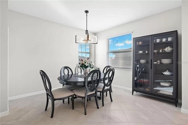 dining area featuring light tile patterned flooring