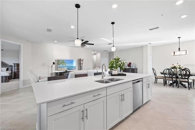 kitchen with dishwasher, sink, an island with sink, white cabinets, and ceiling fan