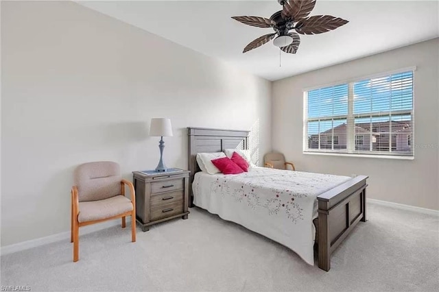 bedroom featuring ceiling fan and light colored carpet