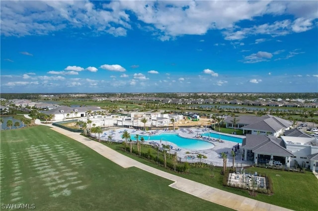 view of swimming pool with a lawn and a patio area