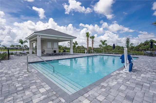 view of pool with a patio and a gazebo