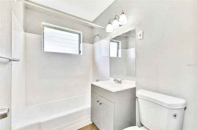 full bathroom with vanity, toilet, and tiled shower / bath