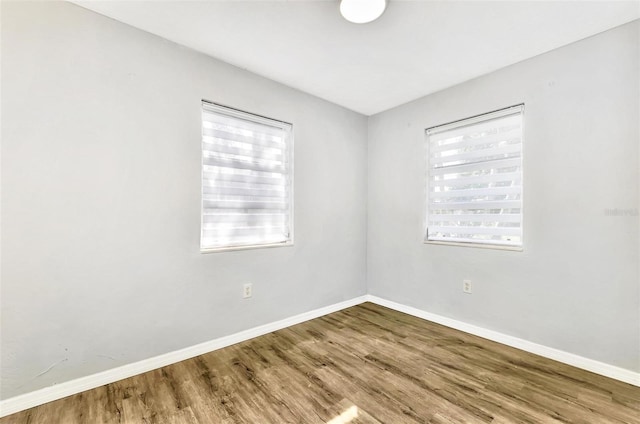 unfurnished room featuring wood-type flooring