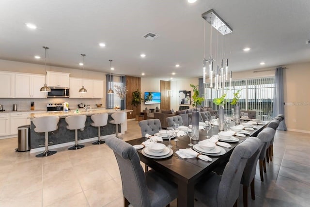 dining room featuring light tile patterned floors