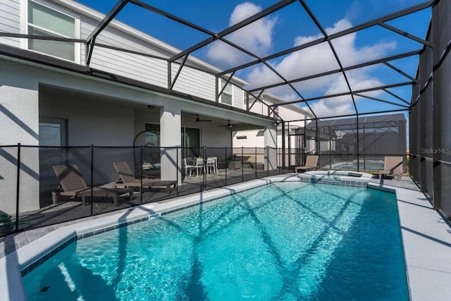 view of pool with ceiling fan, a lanai, an in ground hot tub, and a patio