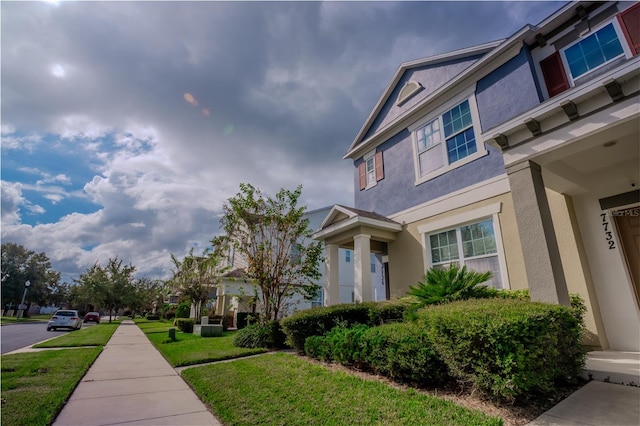 view of home's exterior with a lawn