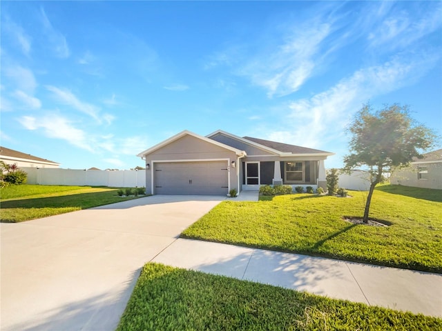 view of front facade with a garage and a front lawn