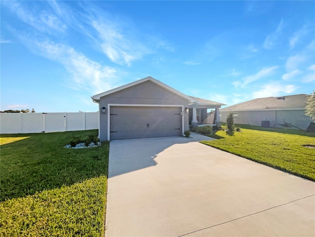 view of front of home with a front yard and a garage