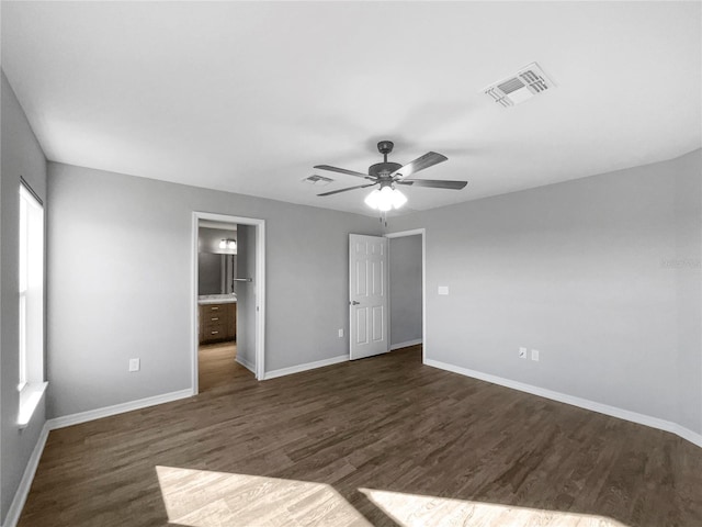 interior space with ceiling fan and dark hardwood / wood-style floors