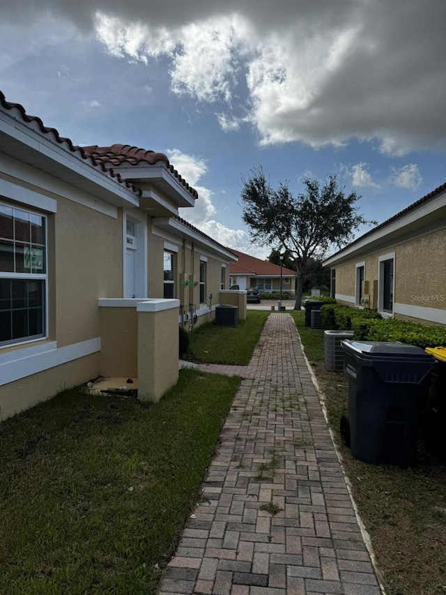 view of home's community with a yard