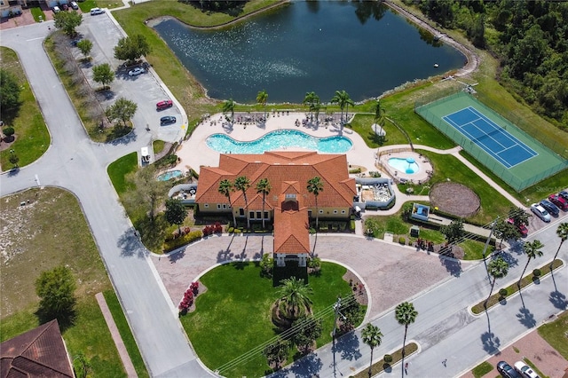 birds eye view of property with a water view