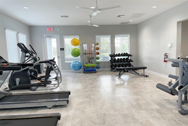 gym featuring a wealth of natural light and ceiling fan