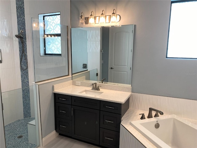 11 Rio Vista Dr, Palm Coast, FL 32137 - full bathroom with plenty of natural light, a garden tub, vanity, and a walk in shower