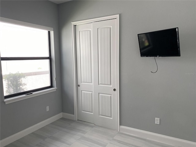 unfurnished bedroom featuring a closet