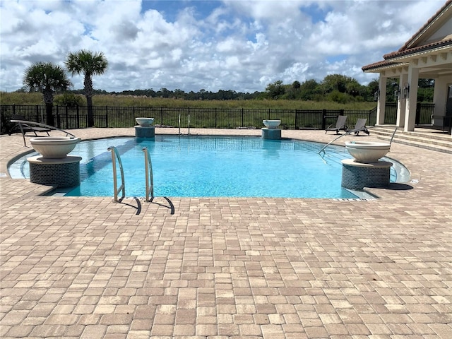 view of swimming pool featuring a patio area