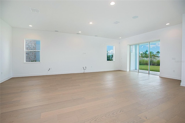 spare room with light wood-type flooring