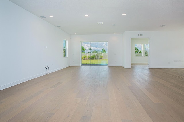 spare room featuring light hardwood / wood-style floors