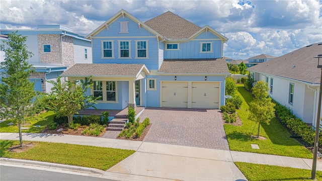 view of front of house featuring a front yard and a garage