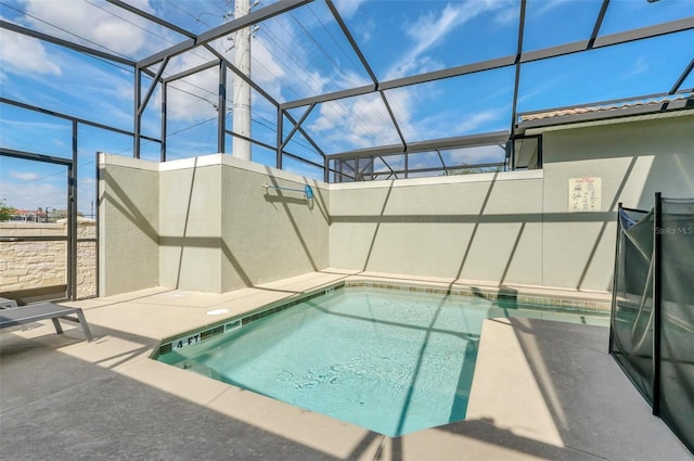 view of pool with a lanai