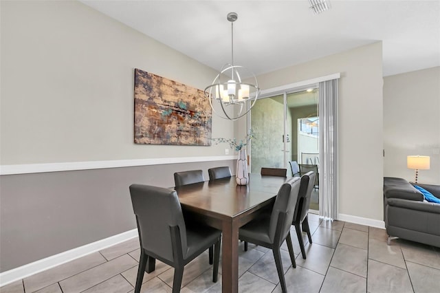 dining space featuring an inviting chandelier and light tile patterned floors