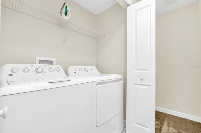 laundry room with carpet flooring and washer and dryer