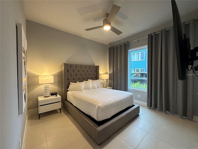 tiled bedroom with ceiling fan