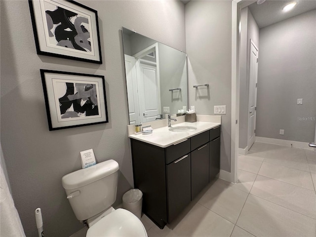 bathroom featuring vanity, toilet, and tile patterned floors