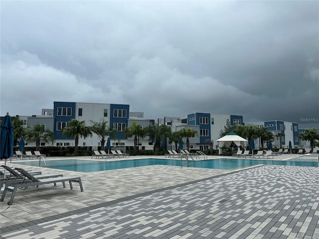 view of swimming pool with a patio