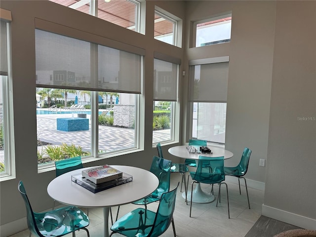 tiled dining area with a healthy amount of sunlight