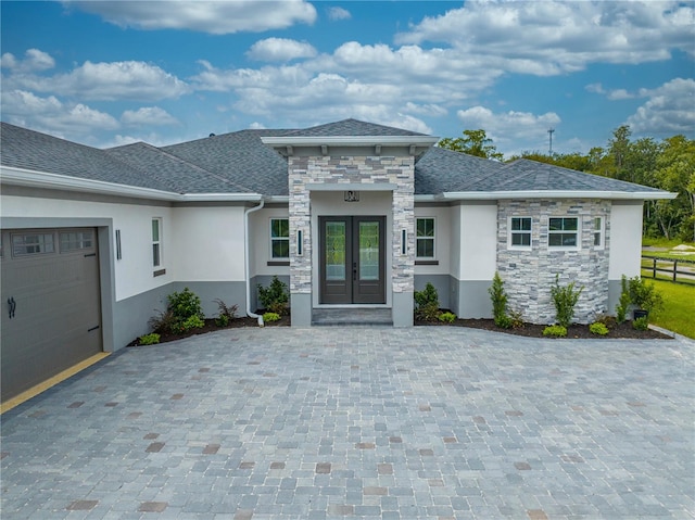 doorway to property with a garage