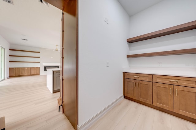 hall with light hardwood / wood-style floors