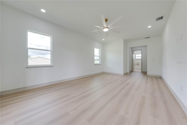 empty room featuring light wood-type flooring and ceiling fan