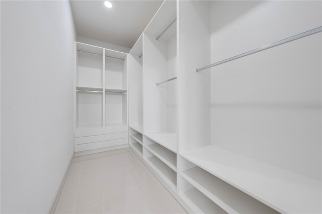 walk in closet with tile patterned floors