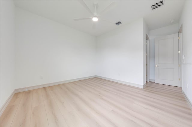 spare room featuring ceiling fan and light wood-type flooring