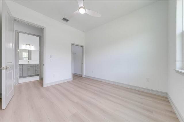 unfurnished bedroom featuring light wood-type flooring and ceiling fan