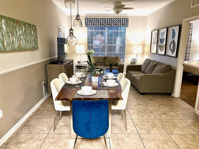 4814 Cayview Ave Unit 21013, Orlando, FL 32819 - dining area featuring light tile patterned floors, baseboards, visible vents, ceiling fan, and ornamental molding