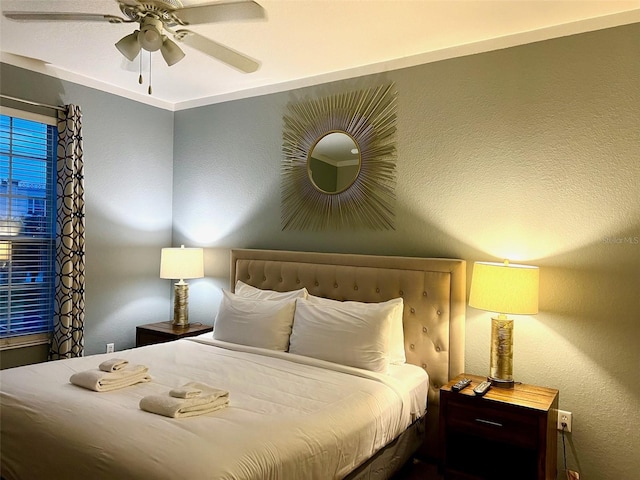 4814 Cayview Ave Unit 21013, Orlando, FL 32819 - bedroom with a ceiling fan and a textured wall