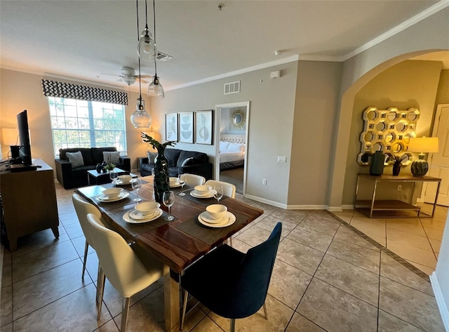 tiled dining room with ornamental molding