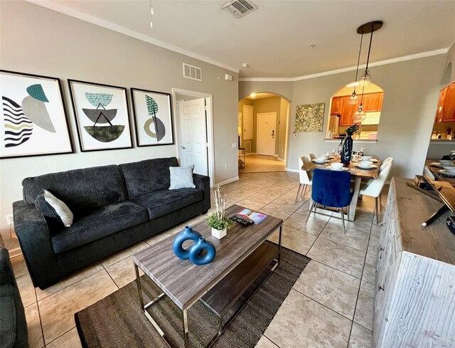 tiled living room featuring ornamental molding