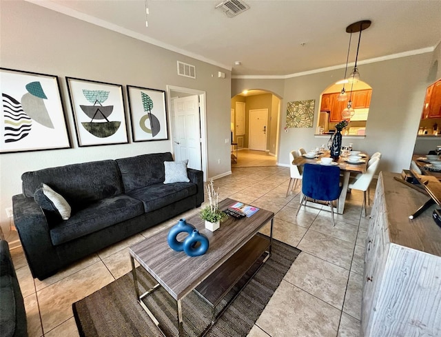 4814 Cayview Ave Unit 21013, Orlando, FL 32819 - living room with arched walkways, visible vents, and crown molding