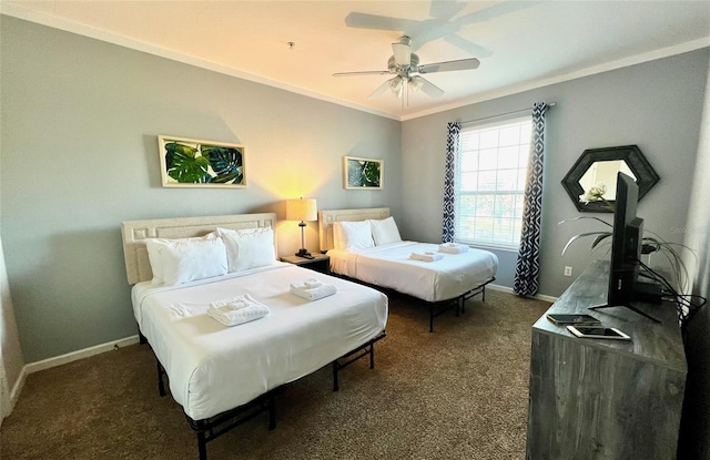 carpeted bedroom featuring ceiling fan and crown molding