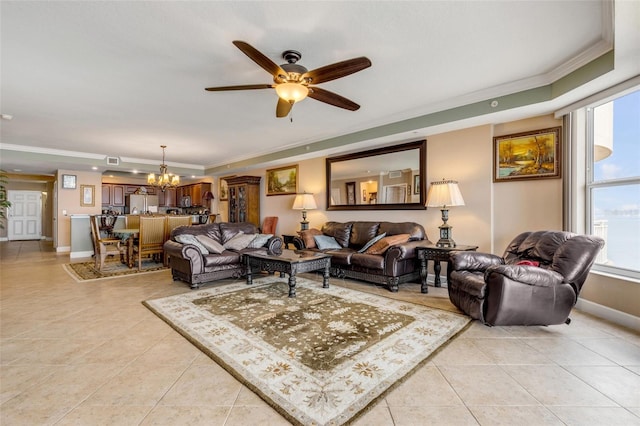 living area featuring light tile patterned floors, ceiling fan with notable chandelier, baseboards, and ornamental molding