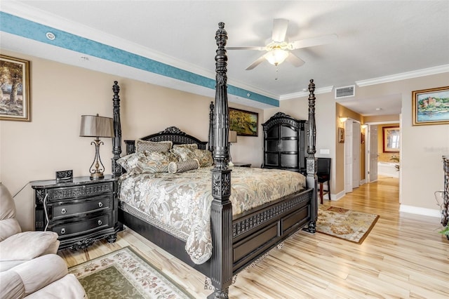 bedroom featuring visible vents, ornamental molding, wood finished floors, baseboards, and ceiling fan