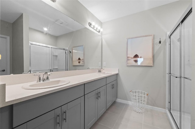 bathroom featuring vanity, an enclosed shower, and tile patterned floors