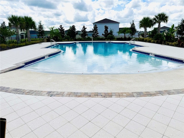 view of swimming pool with a patio