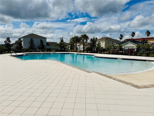 view of pool featuring a patio